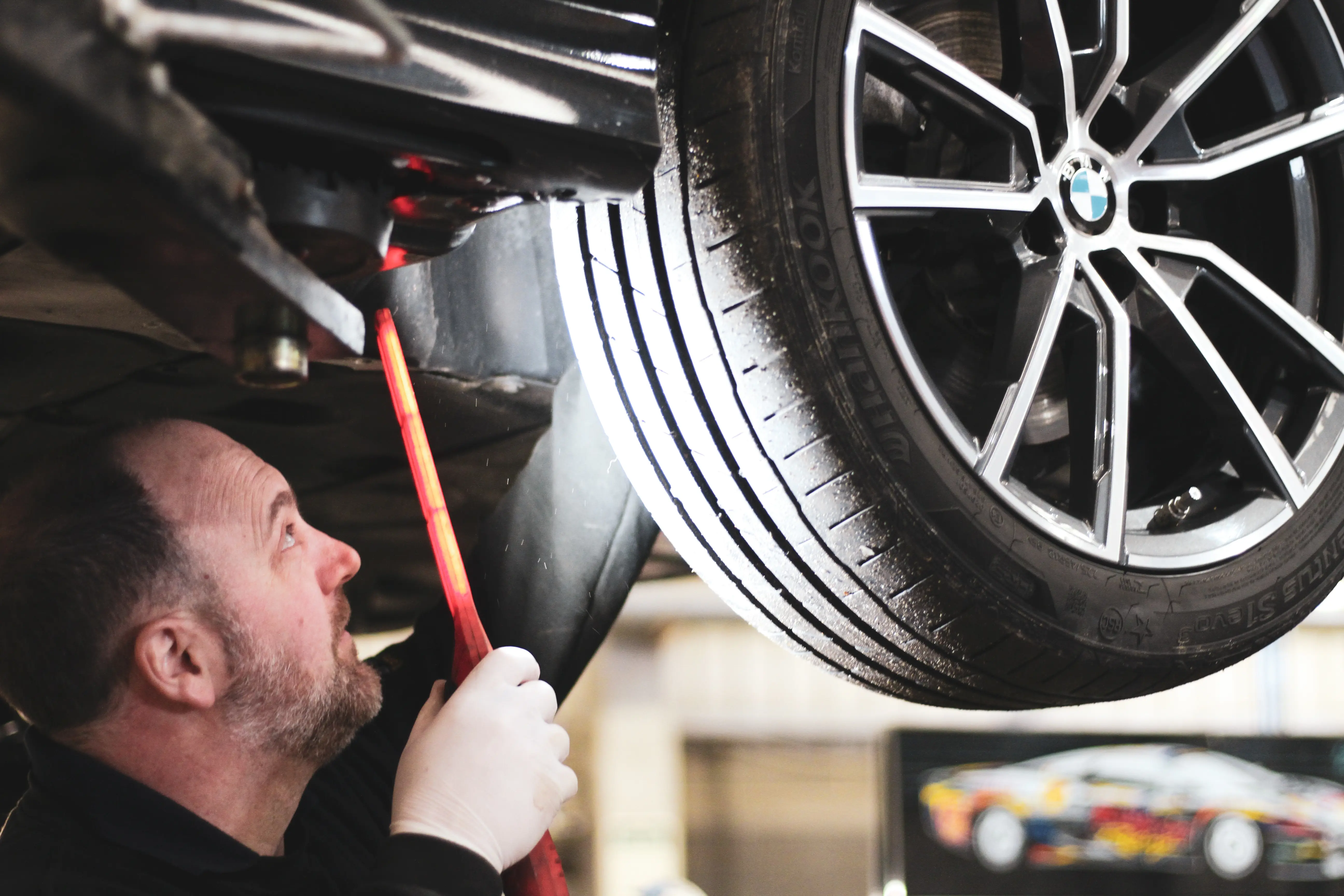 BMW being serviced on a ramp