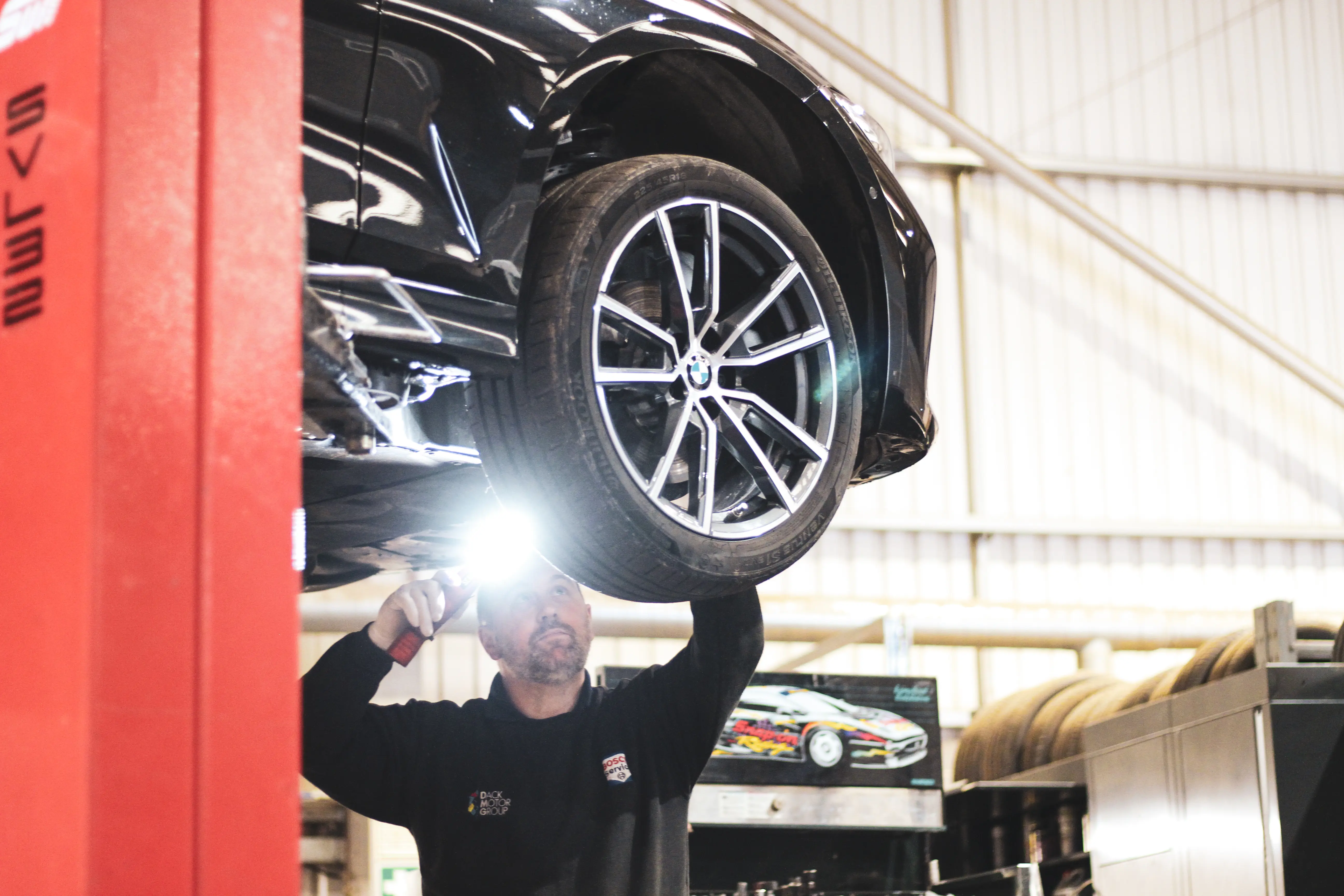 MOT inspection underneath a BMW
